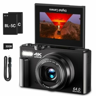 4K digital camera with accessories including batteries, memory card, and strap.