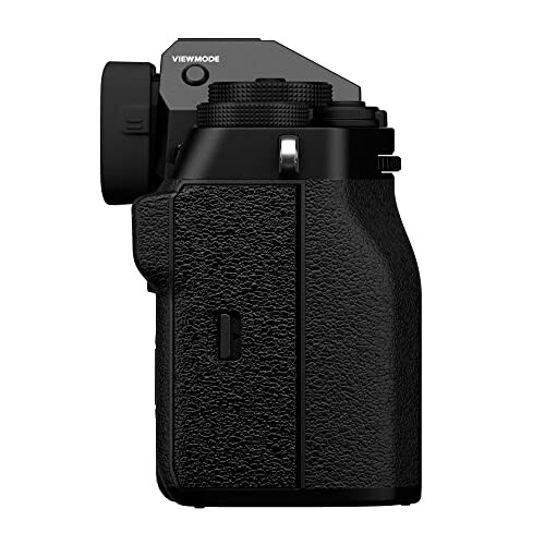 Side view of a black digital camera with textured grip.