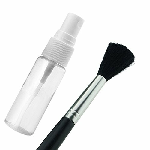 Cleaning brush and spray bottle on white background.