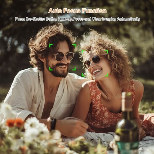 Smiling couple at a picnic with focus indicators on their faces.