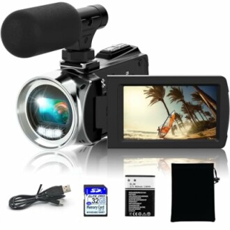 Digital camcorder with microphone, screen showing surfing, USB cable, 32GB memory card, battery, and pouch.