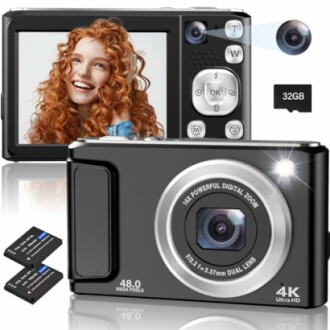 Digital camera featuring dual lens, LCD screen displaying a person, and included 32GB memory card.