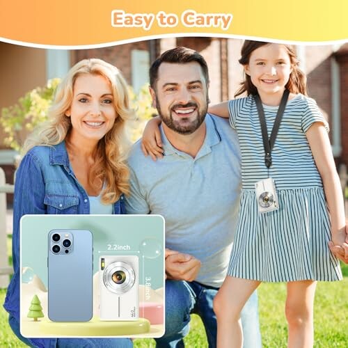 Smiling family outdoors with a child holding a camera.