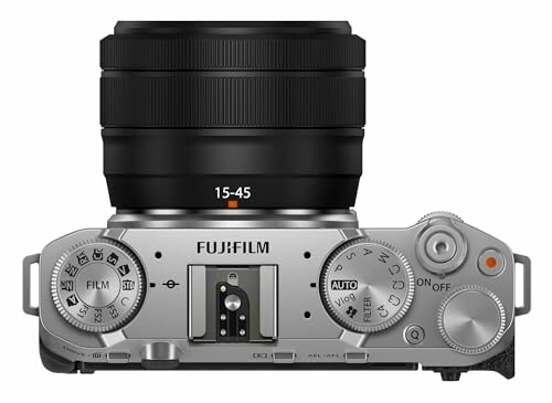 Top view of a Fujifilm camera with controls and lens