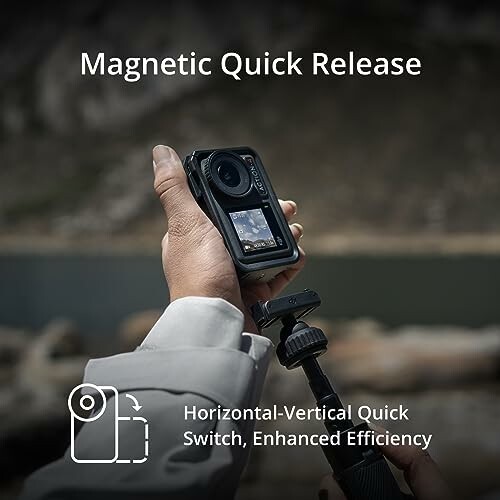 Person holding camera with magnetic quick release feature