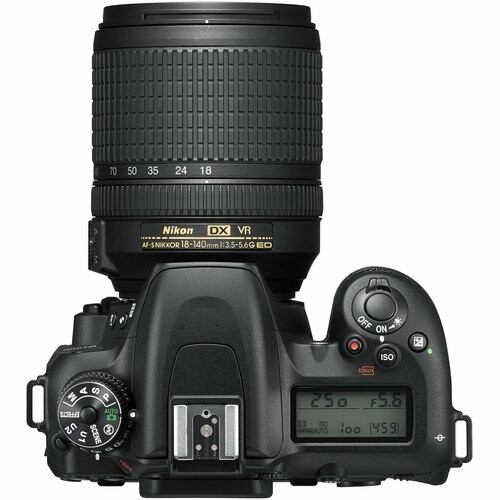 Top view of a Nikon DSLR camera with lens.