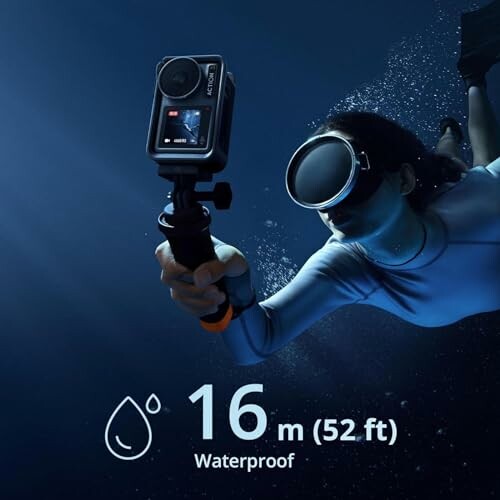 Person underwater holding a camera, 16m waterproof depth displayed.